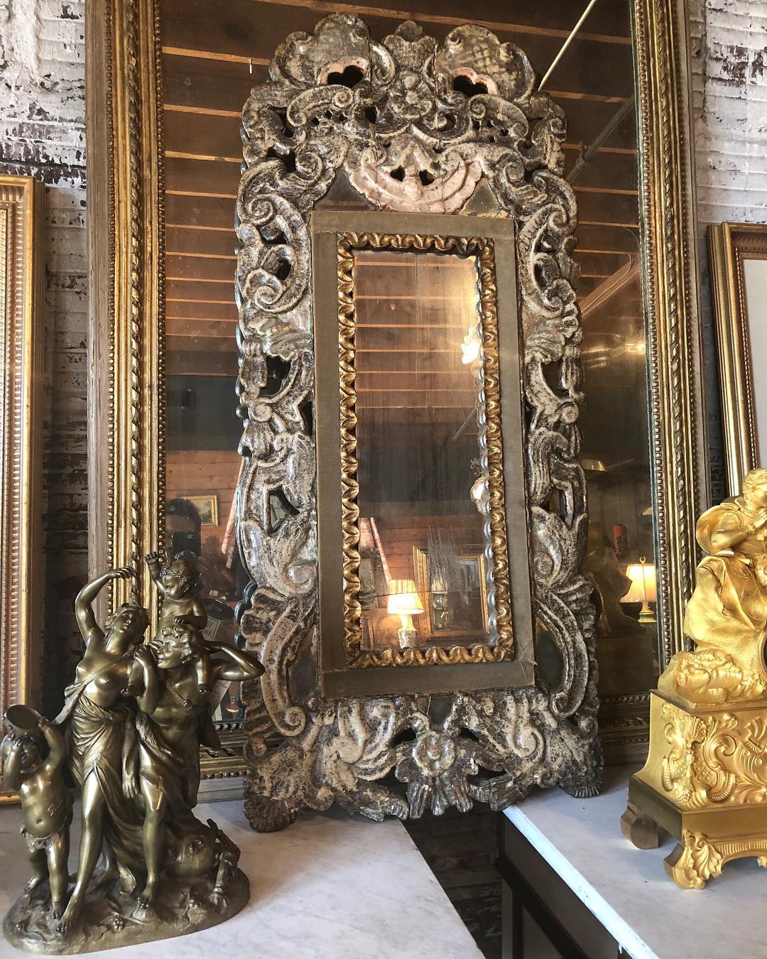 Ornate baroque silvered mirror with carved frame